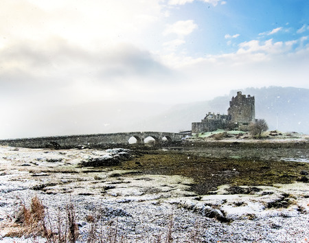 Eilean Donan Castle in winter with falling snow.のeditorial素材