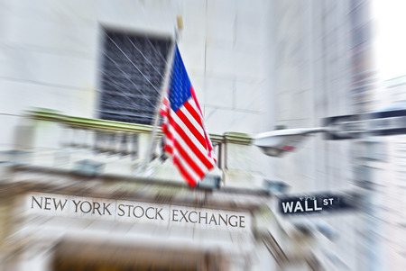 NEW YORK CITY, NY - OCT 11: A street sign of Wall Street and New York Stock Exchange is shown on October 11, 2013 in New York City The Exchange building was built in 1903..のeditorial素材