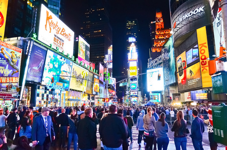 Times Square with lots of visitors at night in New York Cityのeditorial素材