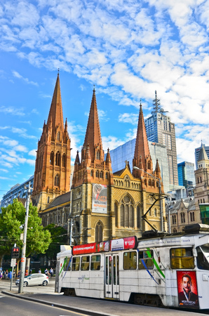 Melbourne, Australia - January 21, 2015: View of St Paul's Cathedral and a tram in Melbourne city center on January 21, 2015.のeditorial素材