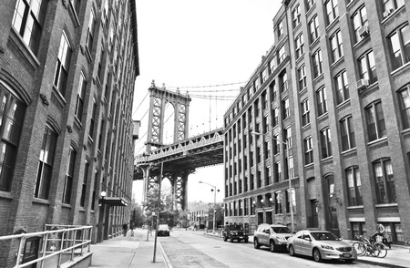 New York, USA - October 8, 2013: View of Manhattan Bridge between buildings from Brooklyn, New York City on October 8, 2013.のeditorial素材