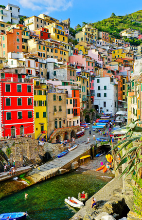 Riomaggiore, Italy - September 8, 2016: View of the colorful houses in a sunny day in Riomaggiore, Italy on September 8, 2016. Riomaggiore is one of the five famous Cinque Terre villages.のeditorial素材