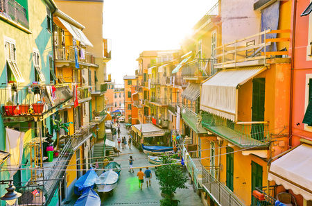 Manarola, Italy - September 8, 2016: View of the colorful houses at sunset in Manarola, Italy on...