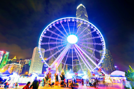 View of the skyline with International Finance Center and Observation Wheel in the financial district of Hong Kong at night on December 31, 2016.のeditorial素材