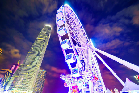 View of the skyline with International Finance Center and Observation Wheel in the financial district of Hong Kong at night on December 31, 2016.のeditorial素材