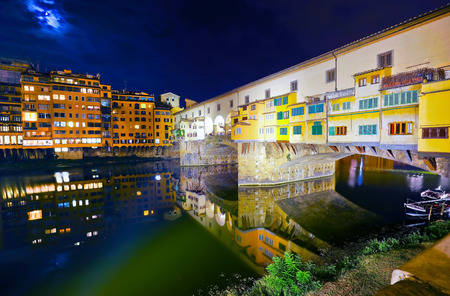 View of the Old Bridge across the Arno River in Florence at night.の写真素材