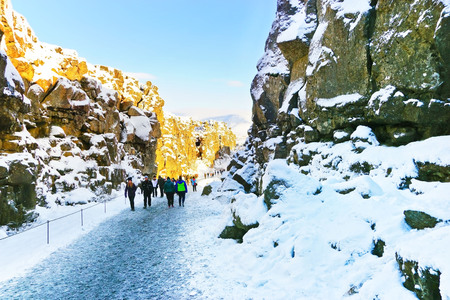 View of the canyon at the Thingvellir National Park with lots of tourists in Iceland in winter on January 28, 2017.のeditorial素材