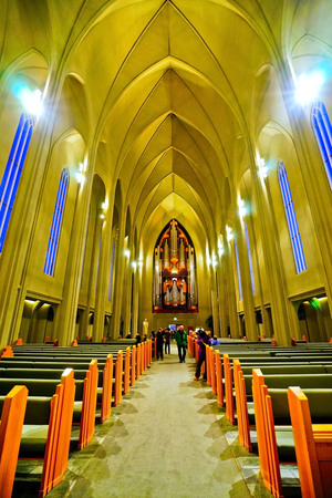 Interior view of the Hallgrimskirkja Church in Reykjavik with several prayers and tourists on January 28, 2017.のeditorial素材