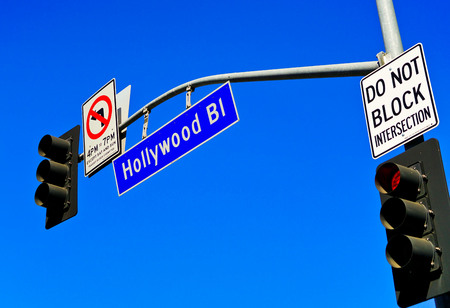 View of the Hollywood Boulevard road signs in Los Angeles on a sunny day.の写真素材