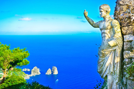 View of the beautiful coastline and Statue of Emperor Augustus from Monte Solaro on the Capri Island in Italy in summer.の写真素材