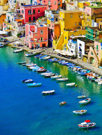 View of the colorful houses at the Port of Corricella in Procida Island, Italy.の写真素材