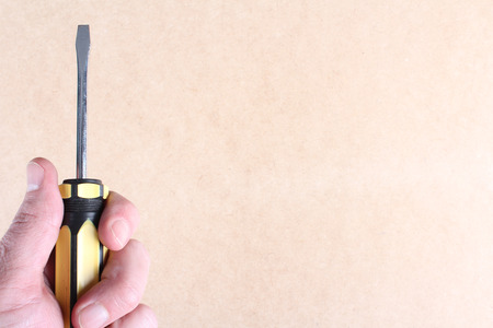 Hand holding a screwdriverのeditorial素材