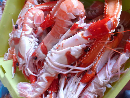 Boiled crayfish in a plastic container, close-upの写真素材