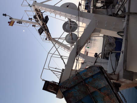 Detail of the mast of a ship with blue sky in the backgroundの写真素材