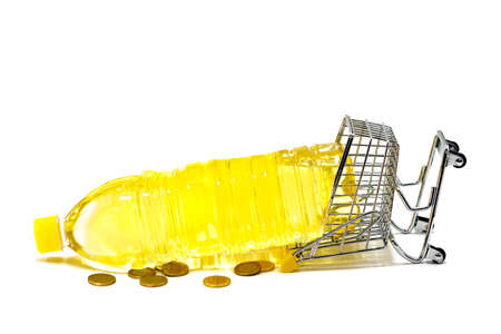 Shopping cart that has fallen because of the weight of a bottle of sunflower oil on white...