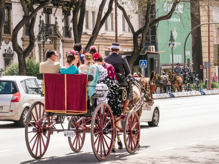 Seville, Spain - May 04, 2022 : Horse carriage heading to the April Fair in Seville, Andalusia,...