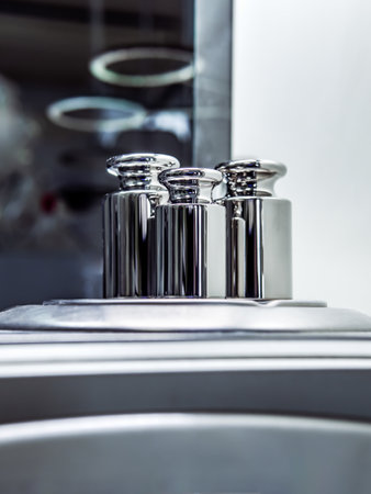 Close-up of the weights used to calibrate an analytical balance.の写真素材