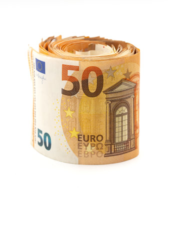 A close-up view of a roll of 50 Euro banknotes on a white background.の写真素材