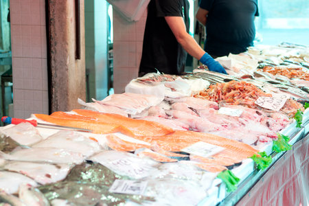 Fresh seafood display at a fish market.の写真素材