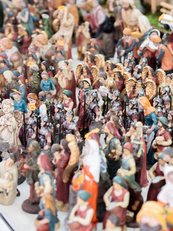 Nativity figurines and animals on a crowded market stall.の写真素材