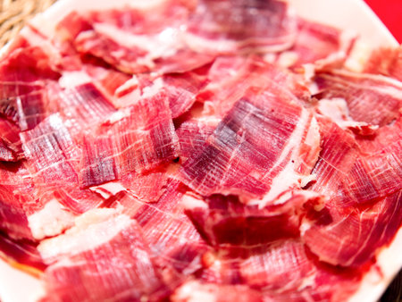 Gourmet spanish Iberian ham slices close-up.の写真素材