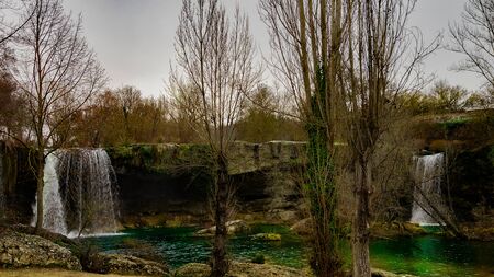 landscape with two cascades of turquoise watersの写真素材