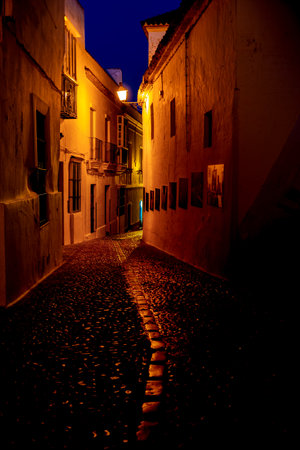 shadow and light between alleys of a townの写真素材