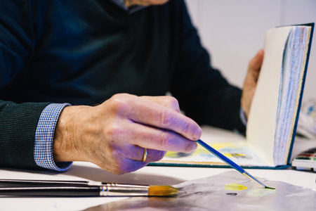 Man painting with airbrushing a work of art