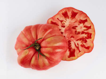 red tomato sliced isolate. Tomato on white background. Tomato top view.の写真素材