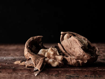 Tasty walnut cracked walnut closeup dark backgroundの写真素材
