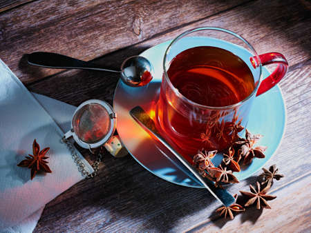 red tea with star anise in blue dishの写真素材