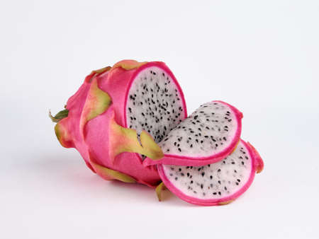 dragon fruit pitaya with cut isolated on whiteの写真素材