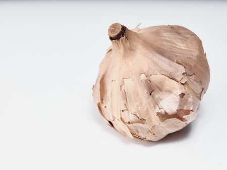 Black garlic isolated on white backgroundの写真素材