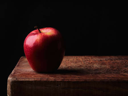 single red apple dark backgroundの写真素材