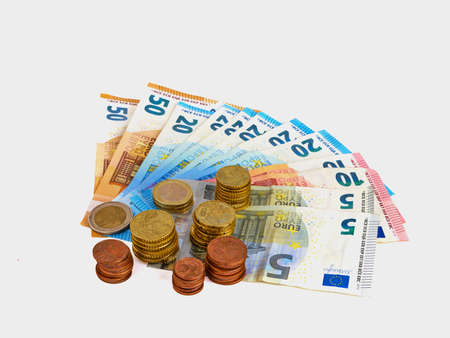 Money euro coins and banknotes isolated on white backgroundの写真素材