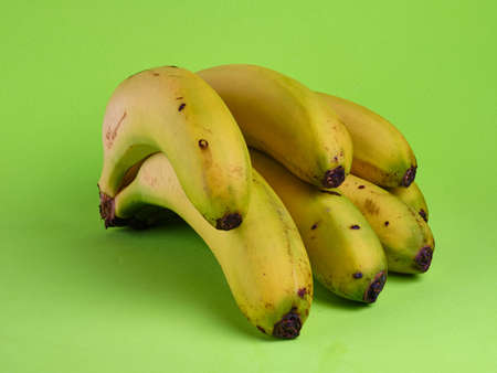 fresh banana bunch on green backgroundの写真素材