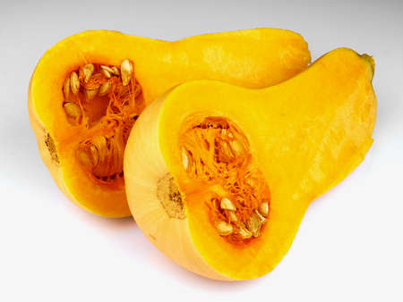 Butternut squash cut in half isolated on white backgroundの写真素材