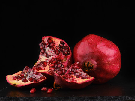 two pomegranate on dark backgroundの写真素材