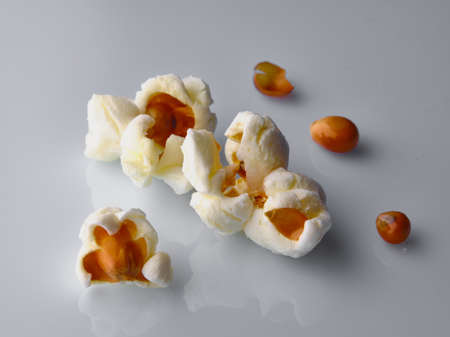 Popcorn detail on white background with shadowsの写真素材