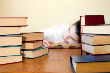 Woman sleeping after a hard study sessionの写真素材