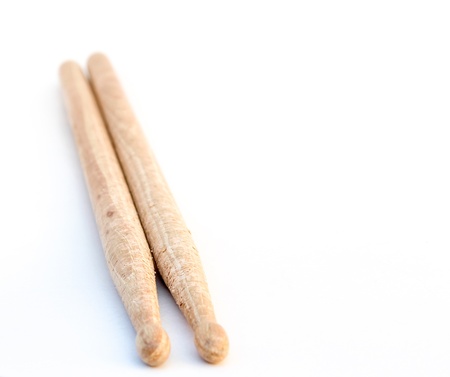 A pair of used wood  Drumsticks on a white backgroud.の写真素材
