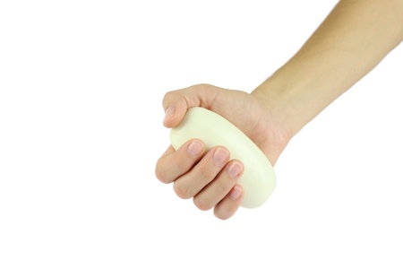Hand holding a fresh bar of soap