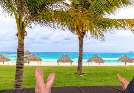 A couple relaxing at a remote beachの写真素材