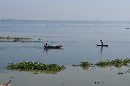 Boats In Lake Near Taungthaman Amarapura, Myanmarの写真素材