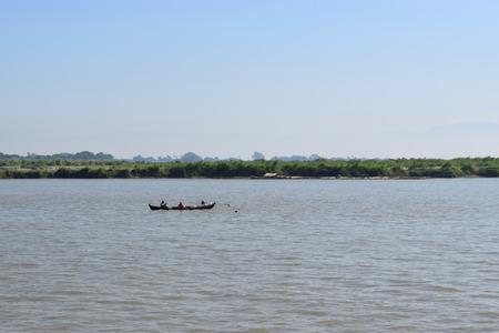 Fishing boat in river Irrawaddy, Myanmarの写真素材