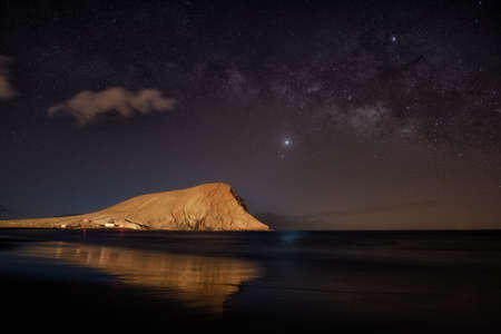 mountain with beach and milky way night photoの写真素材