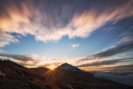 mountain landscape and sea of clouds and blue sky at sunsetの写真素材