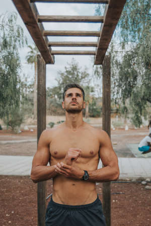 young man exercises with face mask outdoorsの写真素材