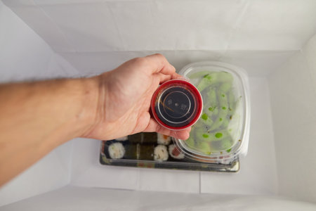 Cultivation of person taking a container with soy from a paper bagの写真素材