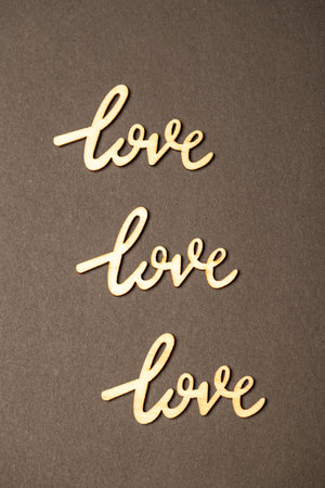 Top view composition of wooden Love signs placed on brown surface for Valentines dayの写真素材